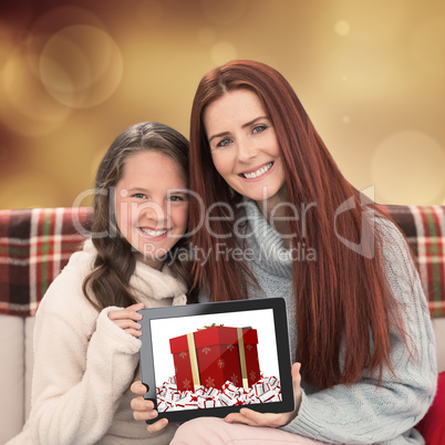 Composite image of mother and daughter showing tablet