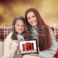 Composite image of mother and daughter showing tablet