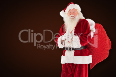 Composite image of santa carries his red bag