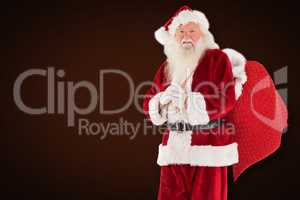 Composite image of santa carries his red bag