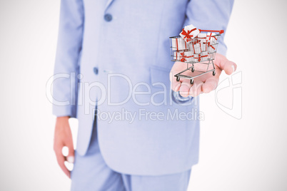 Composite image of handsome businessman gesturing with hands