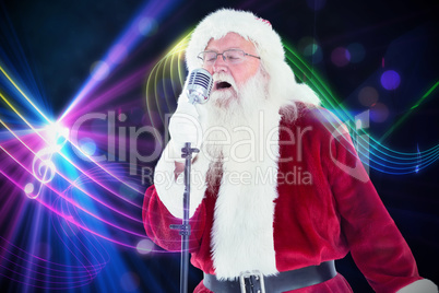 Composite image of santa claus is singing christmas songs