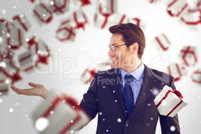 Composite image of businessman with empty hand open