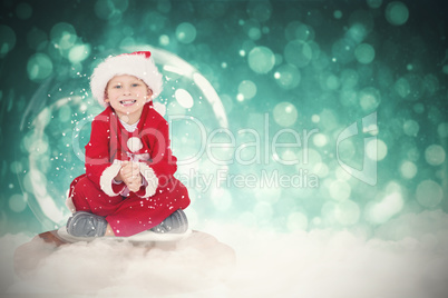 Composite image of festive child in snow globe