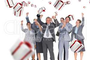 Composite image of excited business team cheering at camera with