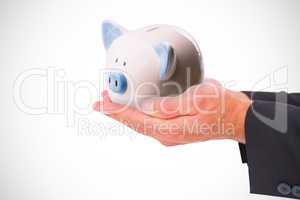 Composite image of businessman holding his hands out