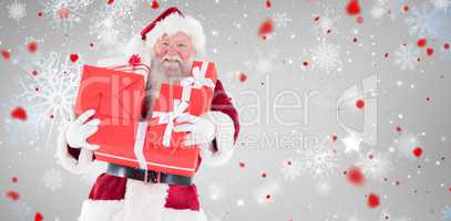 Composite image of santa carries a few presents