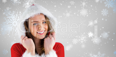 Composite image of sexy santa girl smiling at camera