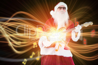 Composite image of santa claus plays guitar with sunglasses