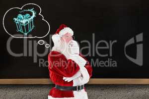 Composite image of santa is thinking about something