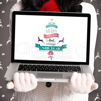 Composite image of woman holding a laptop computer