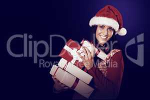 Young brunette with many christmas presents