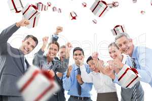 Composite image of business people cheering in office