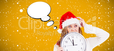 Composite image of festive blonde showing a clock