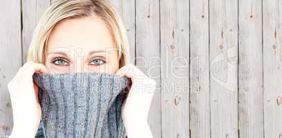 Composite image of delighted woman wearing a poloneck-sweater sm