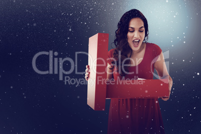 Composite image of brunette thinking and holding shopping bag