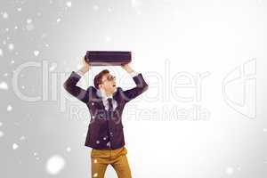 Composite image of young geeky businessman holding briefcase