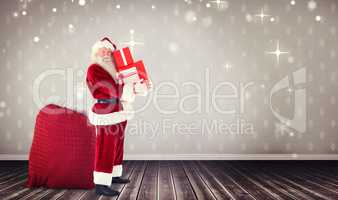 Composite image of santa claus carrying pile of gifts