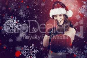 Composite image of festive redhead punching with boxing gloves