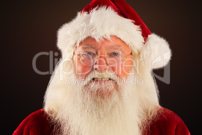 Composite image of santa smiles in the camera