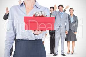 Composite image of businesswoman holding digital tablet