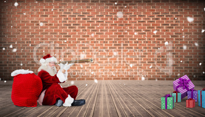 Composite image of santa looking through telescope