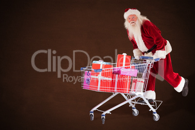 Composite image of santa rides on a shopping cart