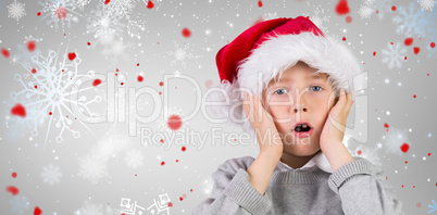 Composite image of festive surprised boy