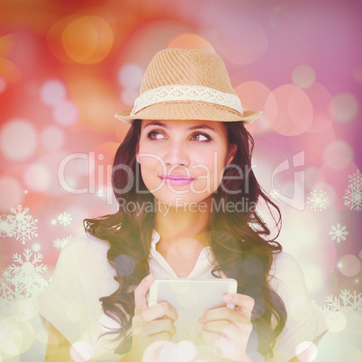 Composite image of pretty brunette holding her phone