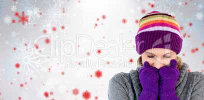 Composite image of freeze woman with gloves and a hat