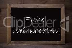 Chalkboard With Frohe Weihnachten Means Merry Christmas