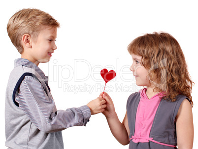 boy gives a little girl heart