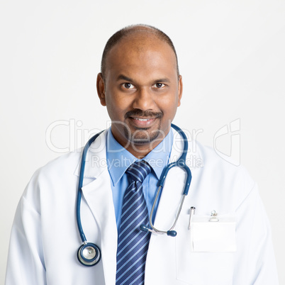 Mature Indian doctor smiling