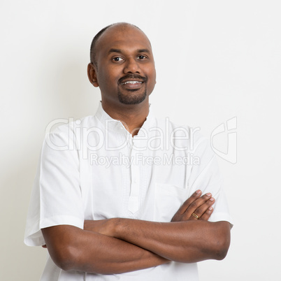 Mature casual business Indian man arms crossed