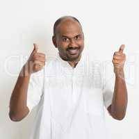Mature casual business Indian man thumbs up