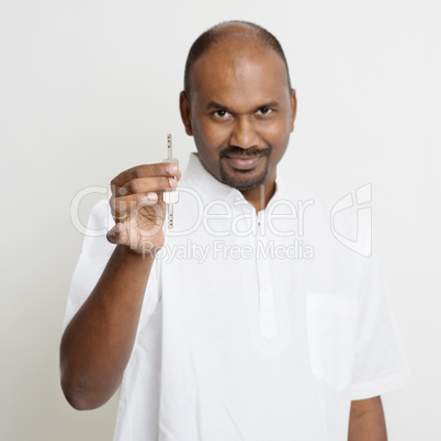 Mature Indian man holding house key