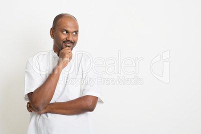 Mature Indian man looking side