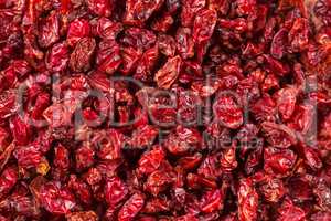 Dried red Tibetan spicy barberries placer background