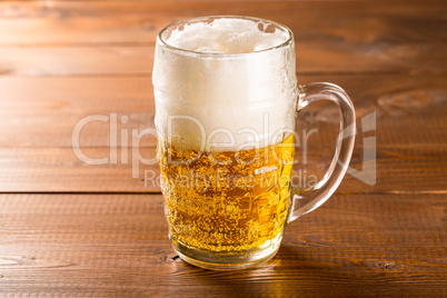 Beer mug on rustic wooden table