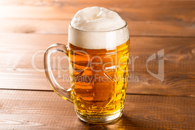 Beer mug on rustic wooden table