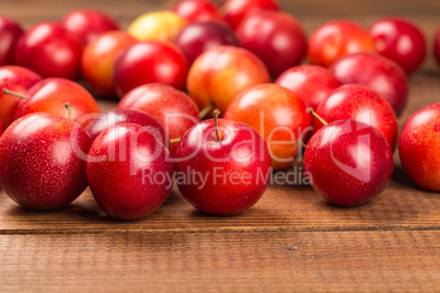 Sweet plums on wooden background