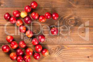 Sweet plums on wooden background