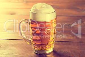 Beer mug on rustic wooden table