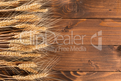 Wheat on wooden background