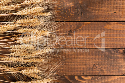 Wheat on wooden background