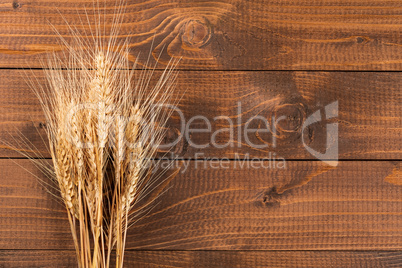 Wheat on wooden background