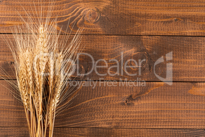 Wheat on wooden background