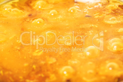 background of the oil in a soup. macro