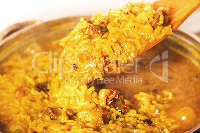 Traditional spicy food called pilaf cooked with fried lamb, rice