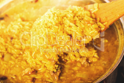 Traditional spicy food called pilaf cooked with fried lamb, rice